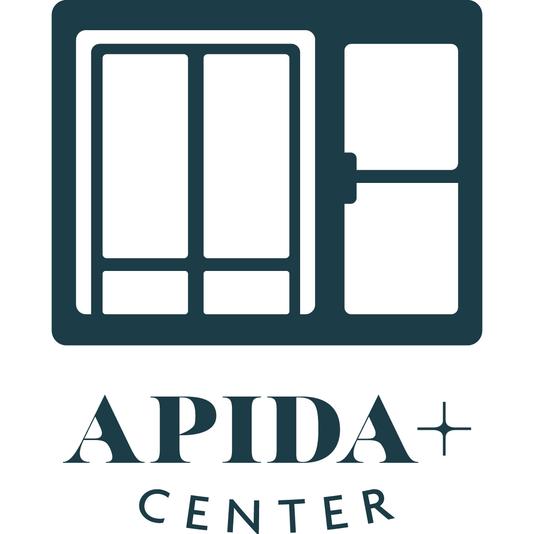 APIDA + Center Logo Green Glass Wall and Door Entrance with Text Underneath